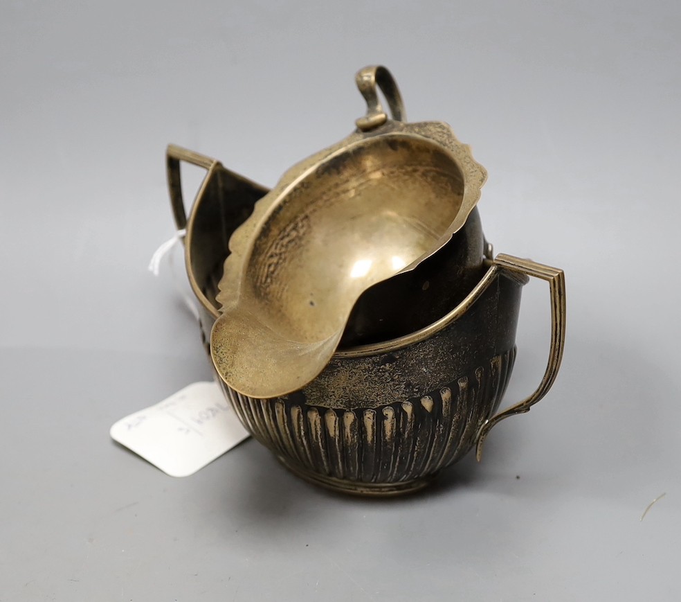 Assorted silver including a Victorian bullet shaped teapot, Arthur Sibley, London, 1878, height 12.1cm, sauceboat, cream jug, sugar bowl, cup, tea strainer, watch holder, match sleeve, pair of ashtrays, lighter, three na